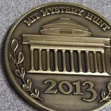 The winner's coin for the 2013 Mystery Hunt, engraved with MIT's Building 7